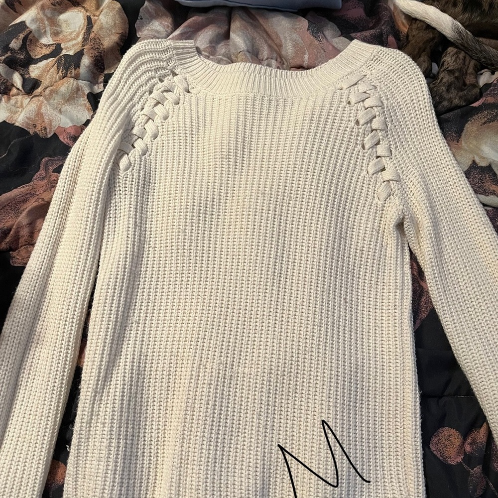 White sweater with braided detail